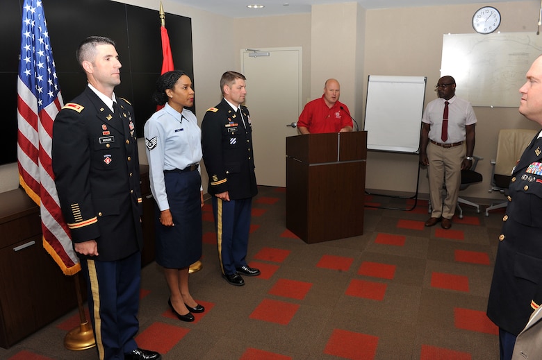U.S. Army Corps of Engineers Public Affairs Specialist and Retired Air Force Master Sgt. Lee Roberts reads the non-Commissioned officers creed at Tech Sgt. Monica White’s promotion ceremony June 9, 2015 at the district's headquarters in Nashville, Tenn. 