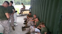 Marines from BWST 7-15 learn about Containerize Batch Laundry (CBL) units through practical application.