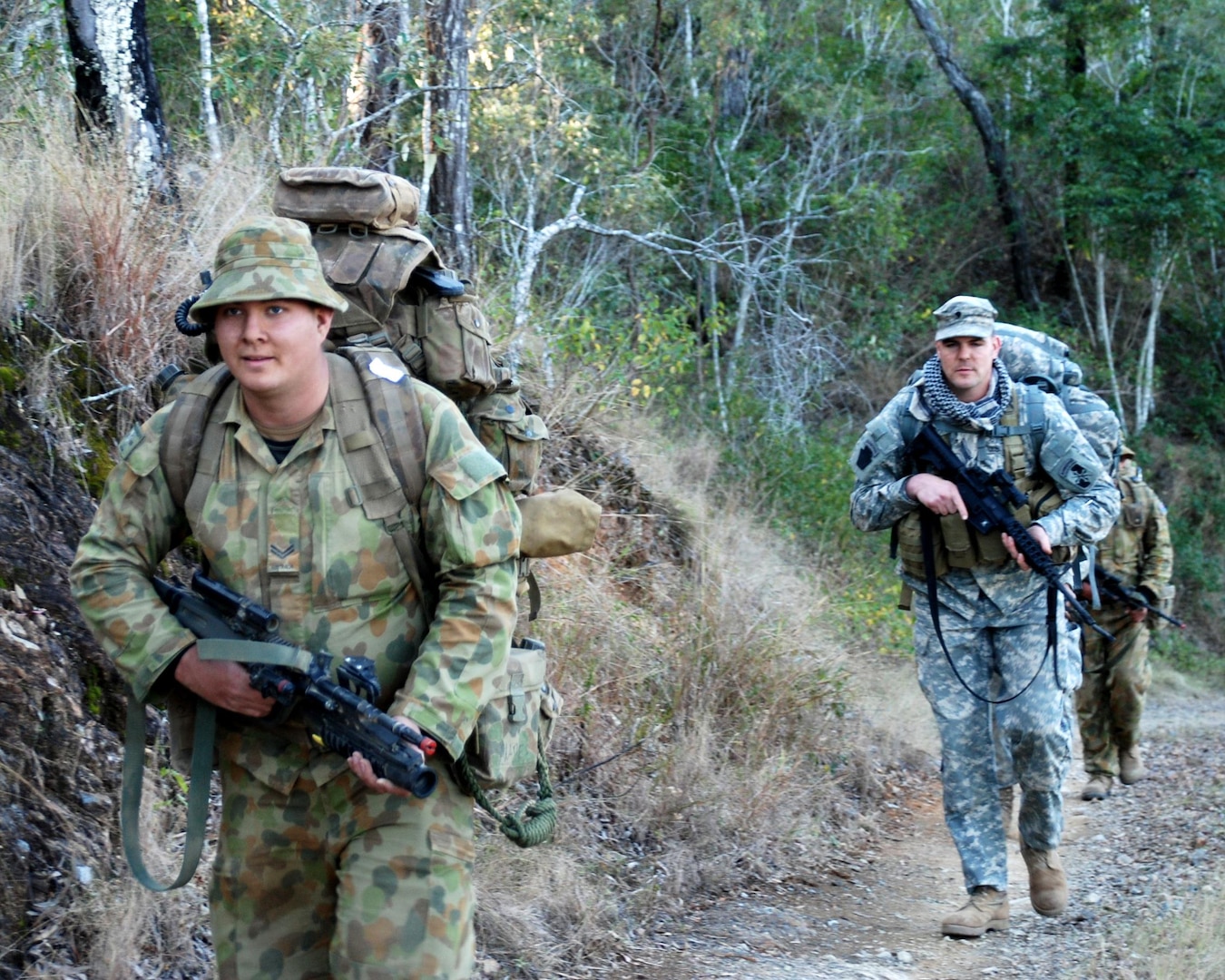 Space systems give an edge to the commanders of Soldiers like Australian Pvt.
Brendan Venables, a member of Northwest Mobile Force, Northern Australia, and
Army Spc. Jason Gutshall, a Maryland National Guard Soldier from Charlie
Company, 1st Battalion, 158th Long Range Surveillance Cavalry in Hagerstown,
Md.