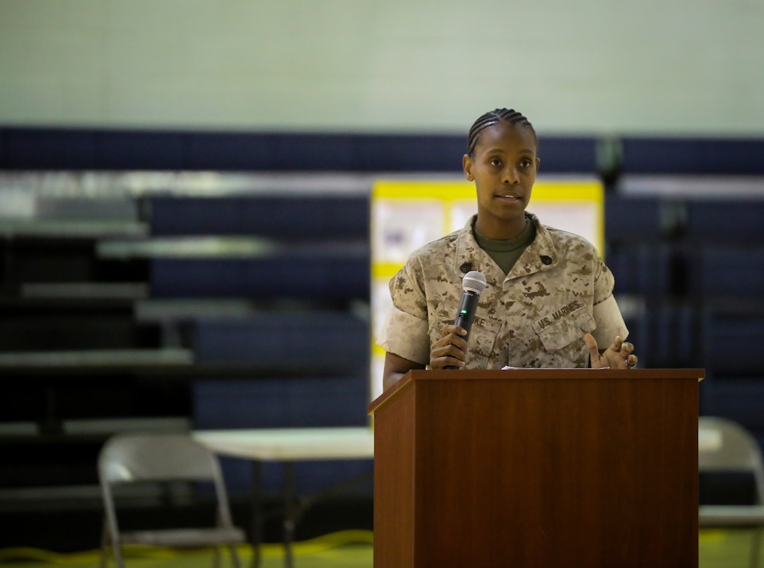 Staff Sgt. Monique Clarke, the guest speaker for the Lesbian, Gay, Bisexual and Transgender and equal opportunity information fair, July 30, 2015, shares her experiences as a gay service member and her passion for all Marines to lead fairly, regardless of their Marines’ sexual orientation. The event was hosted by 2nd Marine Logistics Group to help raise awareness and provide education after the recent addition of sexual orientation to the Equal Opportunity Program. (U.S. Marine Corps photo by Cpl. Chelsea D. Toombs/Released)