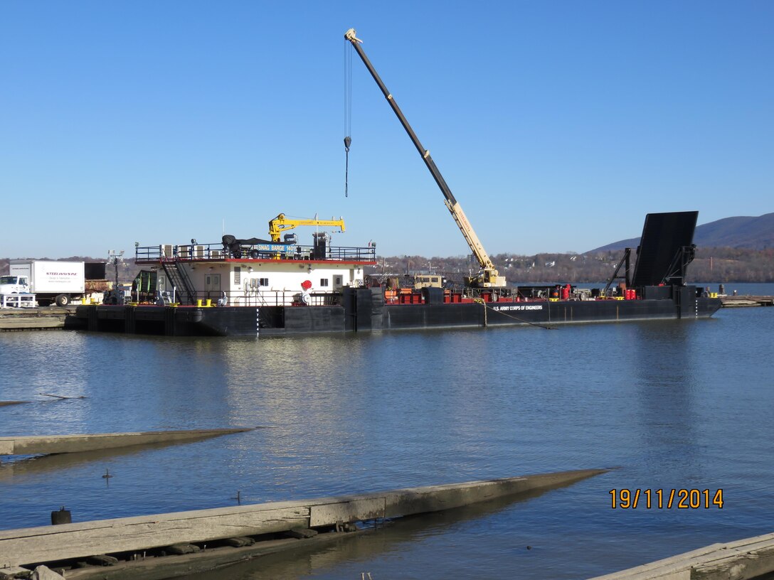 The U.S. Army Corps of Engineers' Marine Design Center managed the design and construction of the USACE CRANE BARGE “GRAVEL SPREADER 1101.” The vessel was commissioned in February of 2012. 