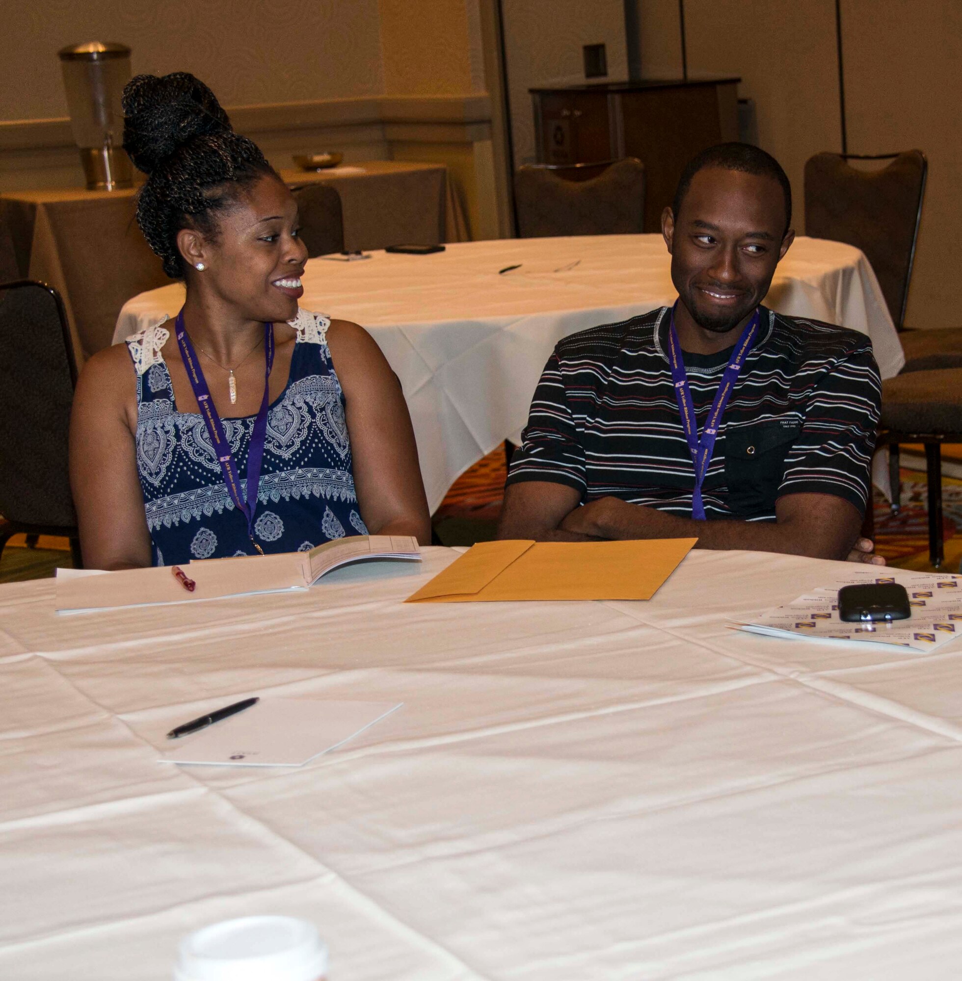 Domonique Powell (left) and her husband, Staff Sgt. Jabez Powell, participate in a body language exercise during a communication class at an Air Force Reserve Yellow Ribbon Reintegration Program event July 25, 2015, in Orlando, Florida. Jabez Powell, who recently returned from his first deployment, is assigned to the 916th Maintenance Squadron at Seymour Johnson Air Force Base, North Carolina. (U.S. Air Force photo by Senior Airman Aja Heiden)