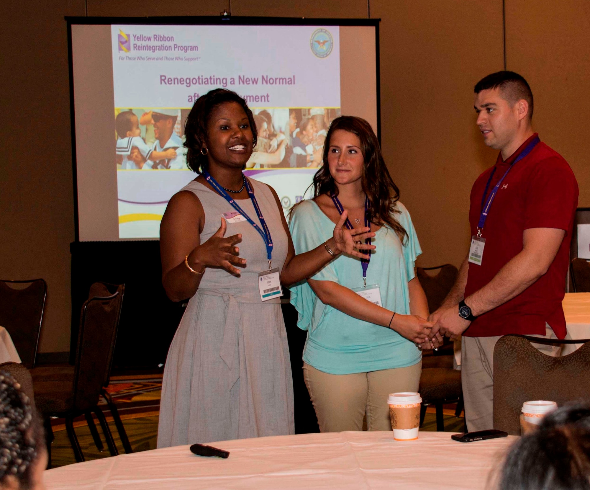 Erin T. King (left) leads Staff St. Chalcea Maggs (center) and Master Sgt. Alex Murray in a communication exercise July 25, 2015, at an Air Force Reserve Yellow Ribbon Reintegration Program event in Orlando, Florida. Maggs and Murray are both assigned to the 911th Aeromedical Evacation Squadron at Pittsburgh International Airport Air Reserve Station in Pennsylvania. (U.S. Air Force photo by Senior Airman Aja Heiden)