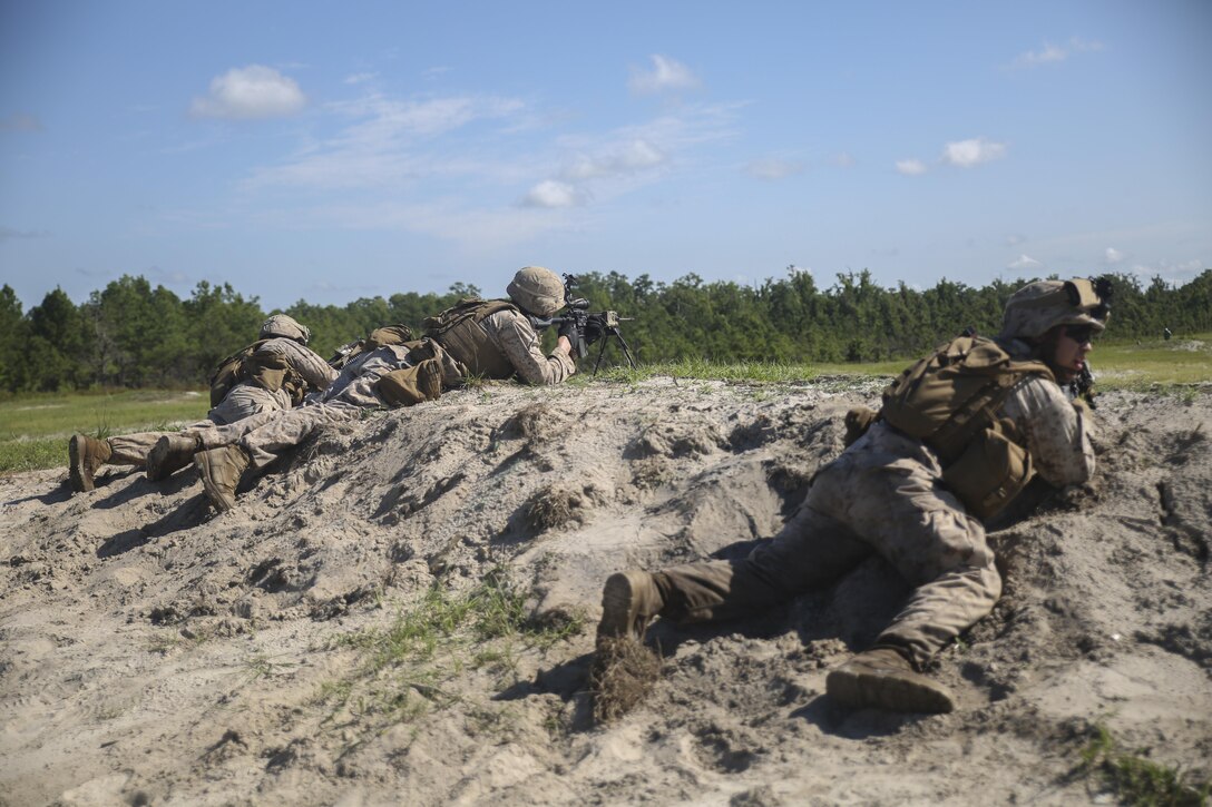 Marines with Golf Company, 2nd Battalion, 2nd Marine Regiment, fire toward a target during a squad attack range at Marine Corps Base Camp Lejeune, North Carolina, July 28. Approximately 50 Marines with the unit participated in the training, which helped build unit cohesion and fire and maneuver skills. (U.S. Marine Corps photo by Cpl. Lucas Hopkins/Released)