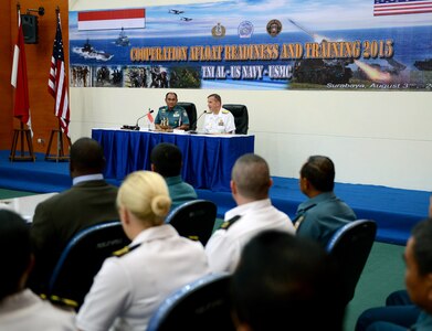 SURABAYA, Indonesia (Aug. 3, 2015) - Rear Adm. Charlie Williams, commander, Task Force (CTF) 73, and Indonesia Assistant Chief of Navy Rear Adm. Arie H. Sembiring address U.S. and Indonesian military members during the opening ceremony of Cooperation Afloat Readiness and Training (CARAT) Indonesia 2015.  In its 21st year, CARAT is an annual, bilateral exercise series with the U.S. Navy, U.S. Marine Corps and the armed forces of nine partner nations including, Bangladesh, Brunei, Cambodia, Indonesia, Malaysia, the Philippines, Singapore, Thailand and Timor-Leste.  