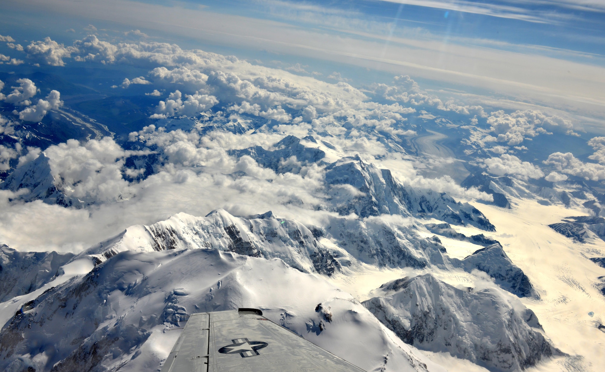 On the way back from the Indian Mountain long-range radar site, a U.S. Air Force C-12 passes over the Alaska Mountain Range. The highest mountain in the range is Mt. McKinley which comes up to 20,322 feet at its highest point. (U.S. Air Force photo by Airman 1st Class Kyle Johnson)