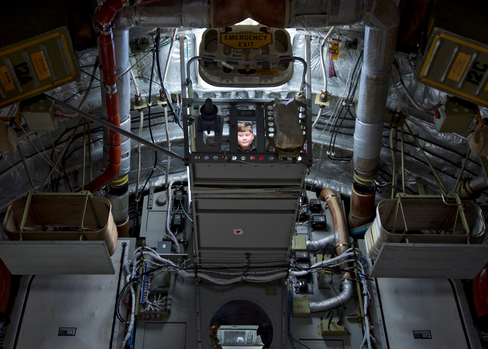 Pilot For A Day Eddie Paul Bearb tours a U.S. Air Force C-17 as part of his first day as a member of the 535th Airlift Squadron at Joint Base Pearl Harbor-Hickam, Hawaii, July 30, 2015. The Pilot For A Day program was created to provide children with serious or chronic conditions the opportunity to experience life as an honorary pilot. (U.S. Air Force photo by 2nd Lt. Kaitlin Daddona/Released)

