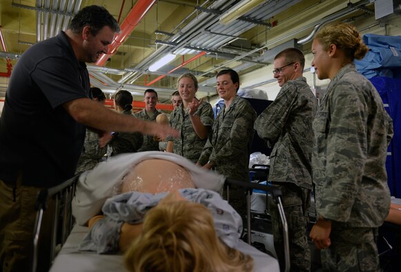 David Capps, 81st Medical Group medical simulation and clinical skills center operator, demonstrates the training features of a high fidelity patient simulator mannequin to Air Force Academy cadets during their tour of the Keesler Medical Center as part of Operation Air Force, July 21, 2015, Keesler Air Force Base, Miss. Available to Academy and ROTC cadets, OAF gives future Air Force officers an in-depth look at what the operational Air Force is like. The cadets toured organizations within the 81st Training Wing and 403rd Wing during their two-week stay. (U.S. Air Force photo by Airman 1st Class Duncan McElroy)