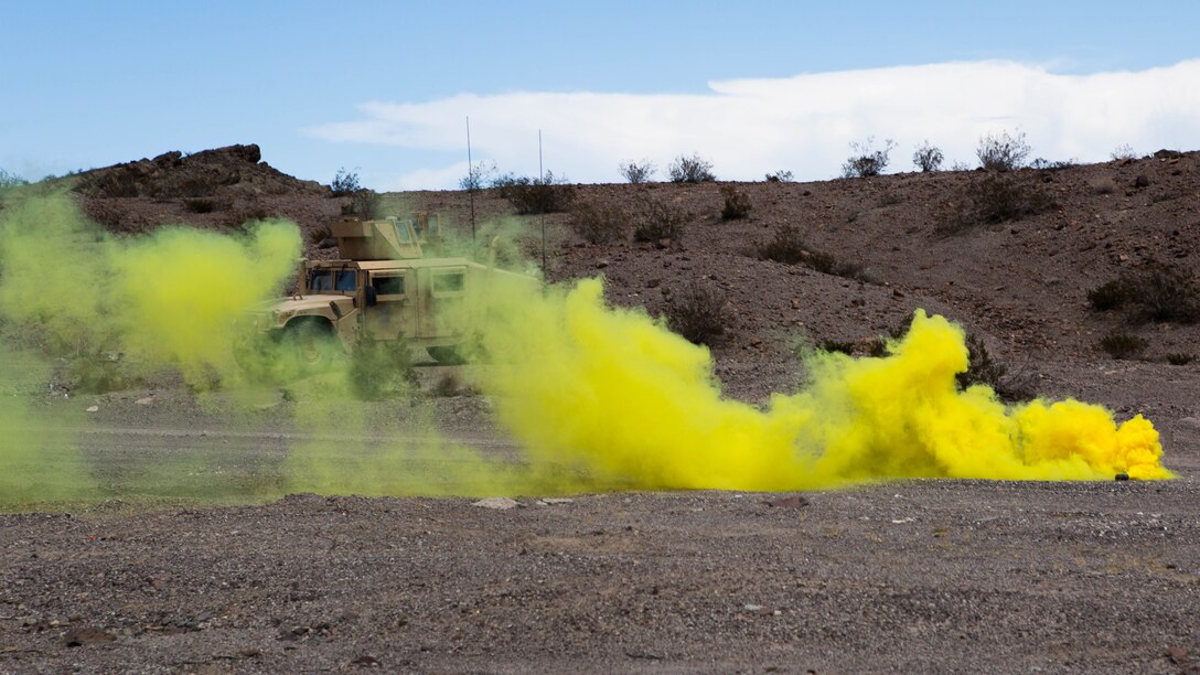 Marines with Truck Company, 3rd Marine Division, III Marine Expeditionary Force, used smoke to signal to aircraft the landing zone for a casualty evacuation during a motorized operations course aboard Marine Corps Air Ground Combat Center Twentynine Palms, California, July 30. The training allowed the Marines to conduct multiple scenarios in order to receive vital feedback on operating procedures.