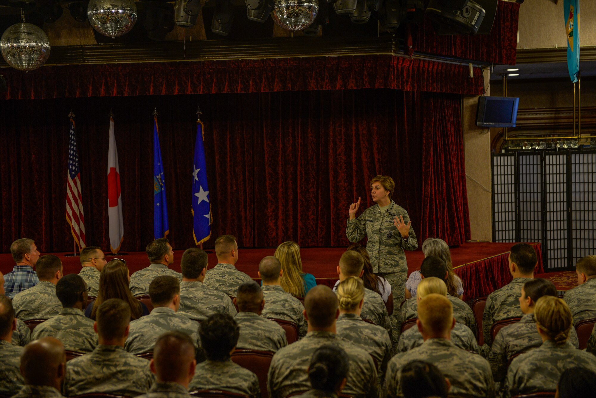 U.S. Air Force Gen. Lori Robinson, Pacific Air Forces commander, answers questions from Airmen during an all-call at Kadena Air Base, Japan, Aug. 4, 2015. Kadena is only one stop for Robinson as she visits U.S. Air Force bases within the command before returning to Joint Base Pearl Harbor-Hickam, Hawaii. (U.S. Air Force photo by Senior Airman Stephen G. Eigel/Released)
