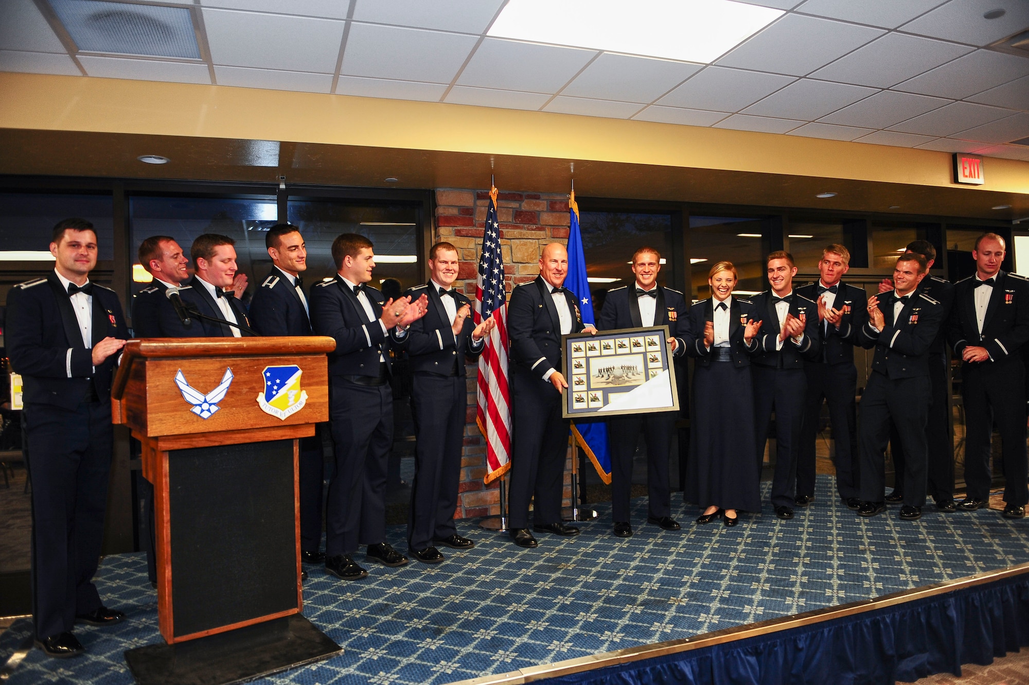 The 311th Fighter Squadron’s inaugural class of F-16 Fighting Falcon pilots poses for a picture with 311th FS leaders after the class’ graduation ceremony July 31 at Holloman Air Force Base, N.M. The class, 14-FBH, is the first class of F-16 pilots to graduate from Holloman. The class graduated 14 students. (U.S. Air Force photo by Amn Randahl J. Jenson)