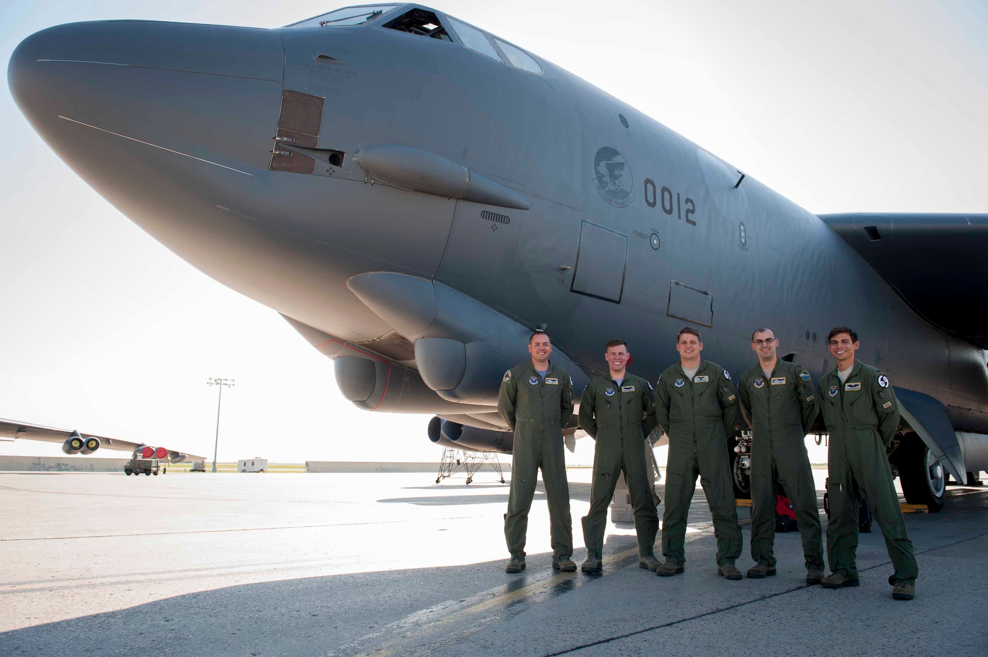 A 69th Bomb Squadron crew poses in front of a B-52H Stratofortress at Minot Air Force Base, N.D., July 31, 2015. Along with four 69th BS aircraft, approximately 180 Minot Airmen who participated in exercise Red Flag exercise returned from Nellis AFB, Nev. (U.S. Air Force photo/Airman 1st Class Sahara L. Fales)