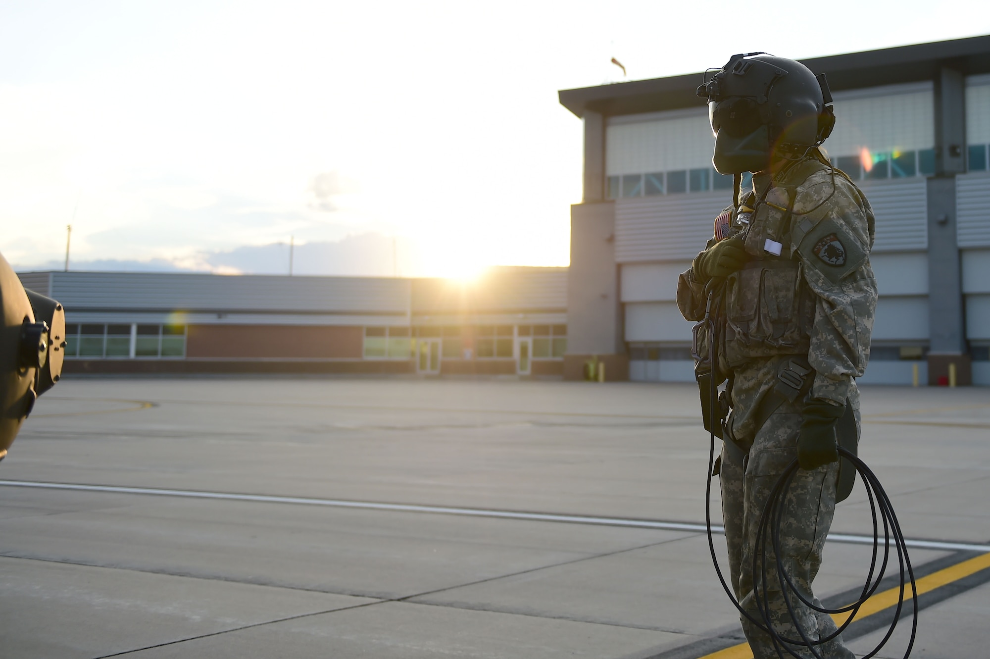Sgt. Barbara Shirley, 2-135th Aviation Battalion crew chief, looks over a UH-60 Black Hawk before takeoff July 29, 2015, on Buckley Air Force Base, Colo. The 2-135th Aviation Battalion is part of the Colorado Army National Guard and has a variety of capabilities that make it a valuable resource to both the state of Colorado and the U.S. Army. (U.S. Air Force photo by Airman 1st Class Luke W. Nowakowski/Released)