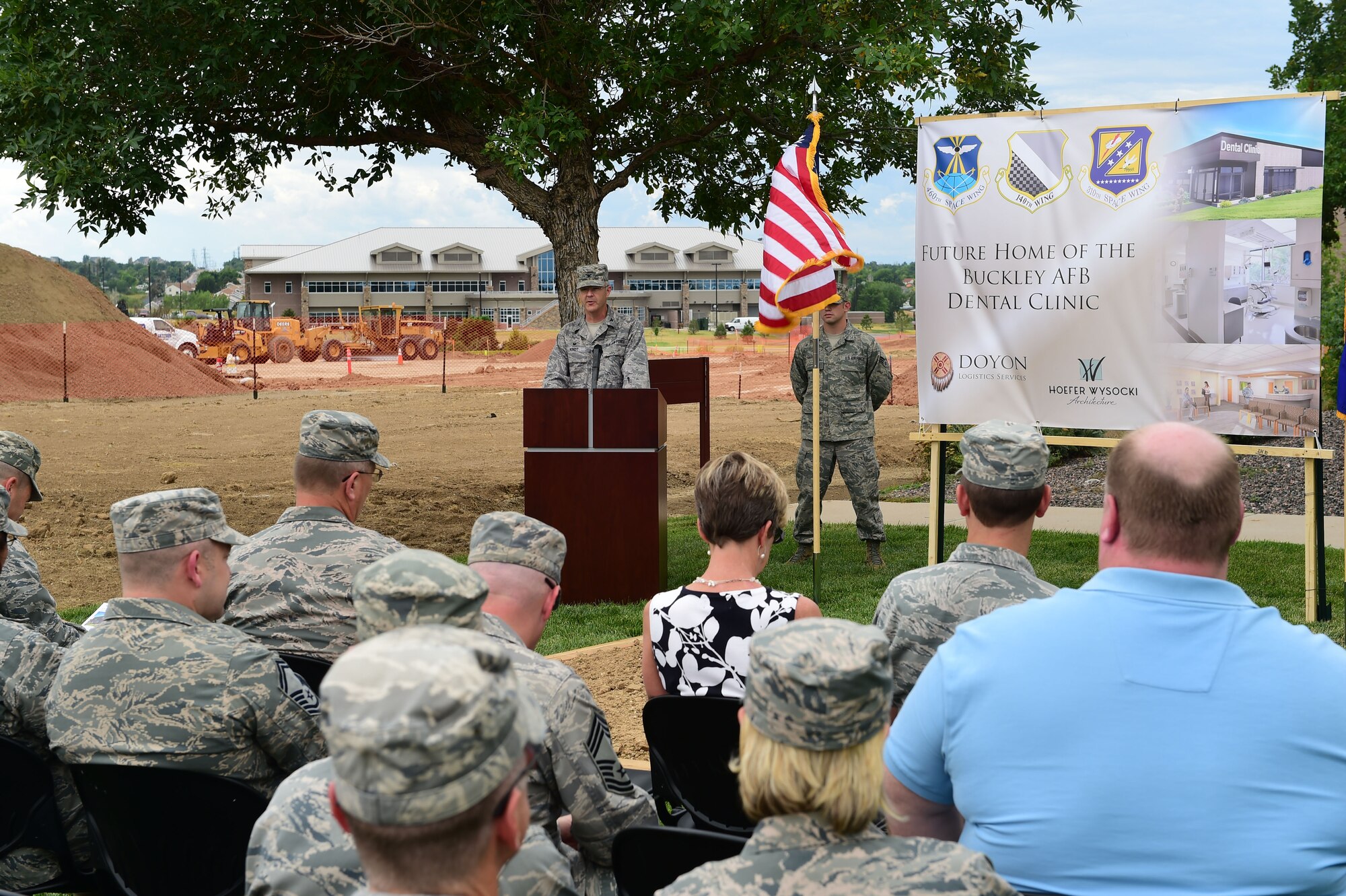 Col. Michael Kindt, 460th Medical Group commander, addresses an audience before breaking ground for the new dental clinic Aug. 3, 2015, on Buckley Air Force Base, Colo. The expansion and reconfiguration of the 460th MDG and 140th MDG building is expected to be completed June 2016. (U.S. Air Force photo by Airman 1st Class Luke W. Nowakowski/Released)