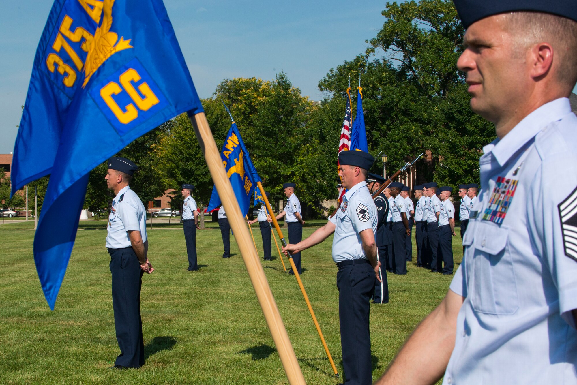Squadrons from the 375th Air Mobility Wing stand at parade rest while awaiting commands during the 375th AMW Change of Command August 3, 2015 on Scott Air Force Base, Illinois. Colonel Laura Lenderman assumes command after serving two years as the Chief, Analysis Branch, Program and Budget Analysis Division, Joint Staff J-8 in Washington D.C. (U.S. Air Force photo/ Senior Airman Tristin English) 