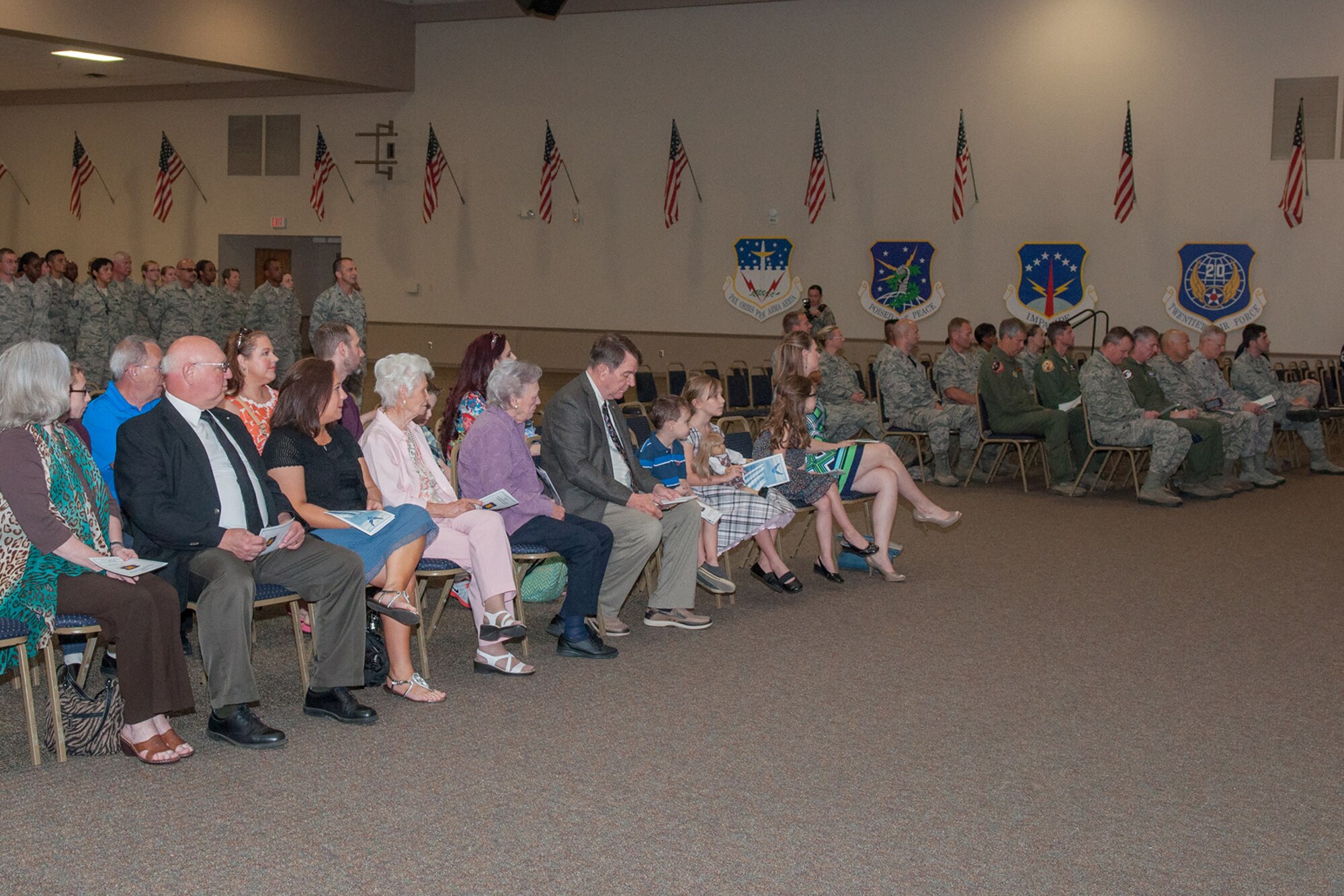 Friends, family and Airmen of the 307th Bomb Wing assemble on Aug. 1, 2015 to see U.S. Air Force Maj. George Cole III assume command of the 307th Maintenance Squadron on Barksdale Air Force Base, La. Cole is now the commander of the largest squadron in the 307th Bomb Wing. (U.S. Air Force photo by Master Sgt. Dachelle Melville/Released)