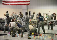 Airmen from the 341st Missile Wing engage in a water fight at the 341st MW Combat Dining Out July 31, 2015, at Malmstrom Air Force Base, Mont. Airmen get to wear Airman battle uniforms and get to have fun with props and imaginations. (U.S. Air Force photo/Airman 1st Class Magen M. Reeves)