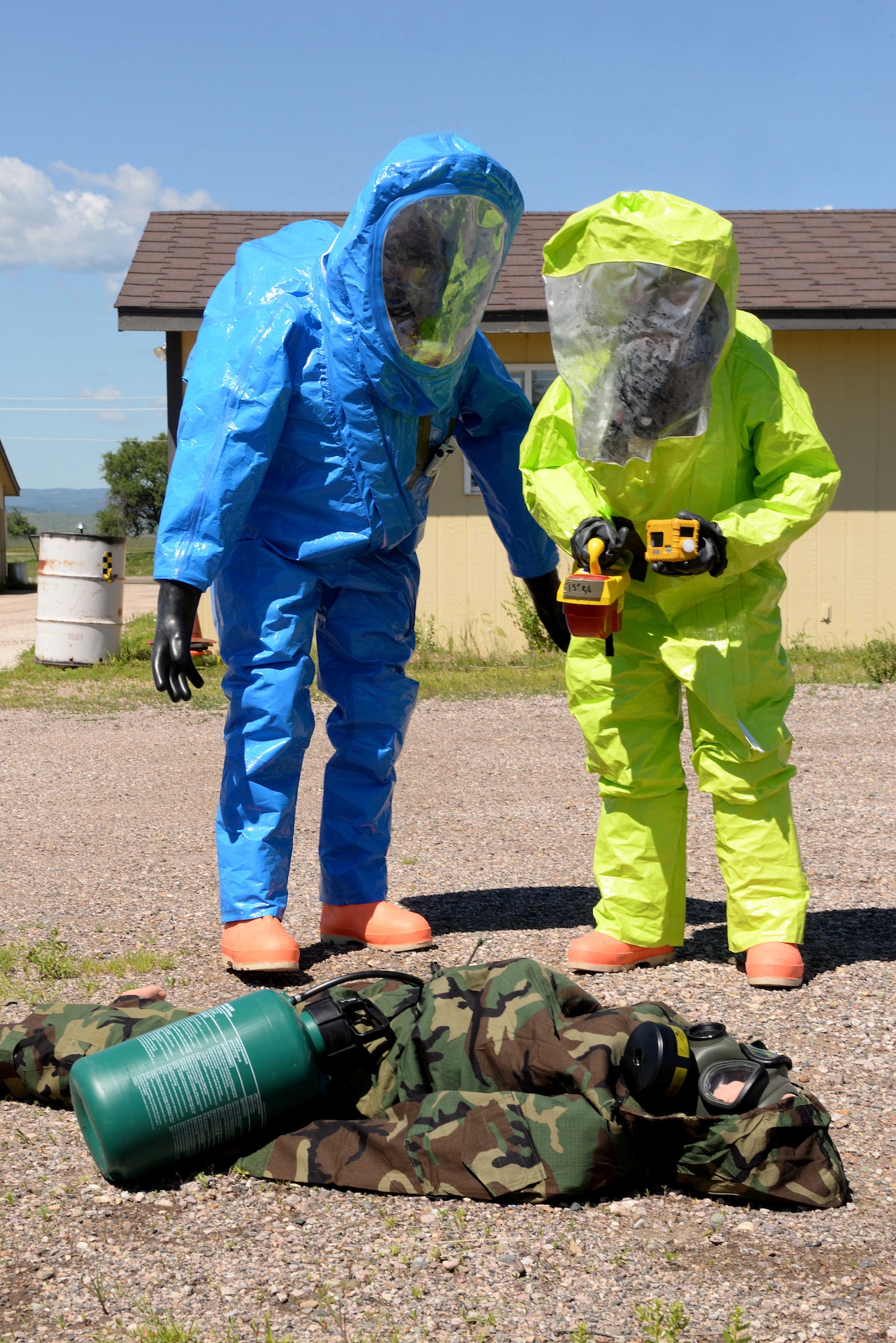 Airmen of the 28th Medical Operation Squadron bioenvironmental engineering flight participate in an integrated base emergency response capabilities training exercise at Camp Lancer at Ellsworth Air Force Base, S.D., July 16, 2015. The week-long exercise provided Airmen with training opportunities for chemical, biological, radiological and nuclear threats. (U.S. Air Force photo by Senior Airman Rebecca Imwalle/Released)