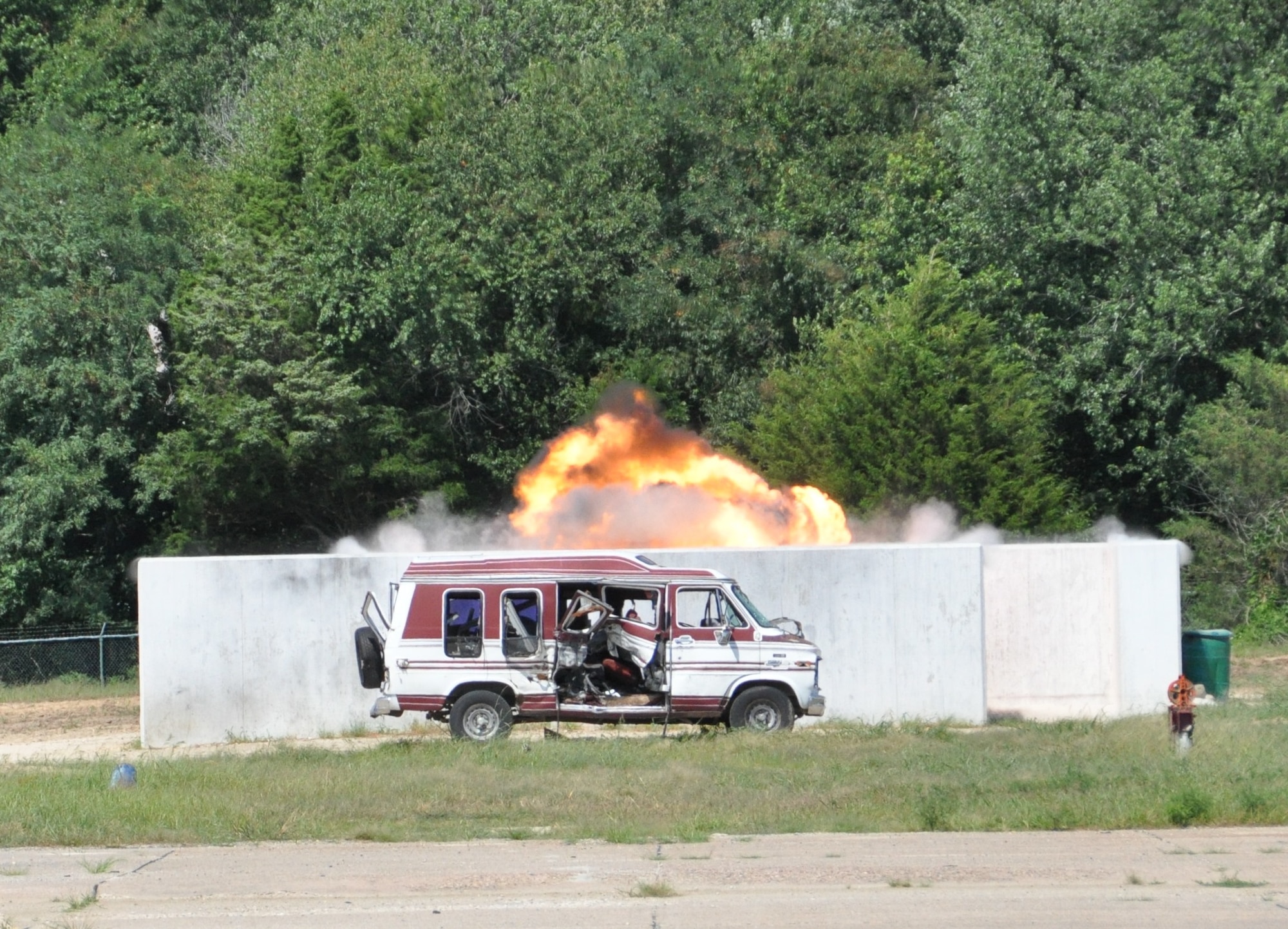 A fireball emerges from an explosion site during a conventional weapons disposal training exercise Aug. 1, 2015, at Dover Air Force Base. The 512th Explosive Ordnance Disposal Flight detonated blocks of dynamite and Composition C-4 during the exercise to simulate the disposal of a conventional weapons cache deemed a threat to U.S. warfighters. (U.S. Air Force photo/Staff Sgt. Joe Yanik)