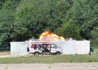 A fireball emerges from an explosion site during a conventional weapons disposal training exercise Aug. 1, 2015, at Dover Air Force Base. The 512th Explosive Ordnance Disposal Flight detonated blocks of dynamite and Composition C-4 during the exercise to simulate the disposal of a conventional weapons cache deemed a threat to U.S. warfighters. (U.S. Air Force photo/Staff Sgt. Joe Yanik)