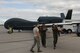 Senior Airman Steven Hayes, left, 69th Maintenance Squadron crew chief, Capt. Joshua, center, 348th Reconnaissance Squadron DOC, and Capt. Manuel, right, 348th Reconnaissance Squadron standards and evaluations liaison officer, perform a pre-flight check July 28, 2015 at Grand Forks Air Force Base, N.D. Grand Forks AFB was one of several agencies involved in Red Flag 15-3. Red Flag is a three-week training exercise used to prepare Airmen for combat in air, space and cyberspace. (U.S. Air Force photo by Airman 1st Class Ryan Sparks/released)