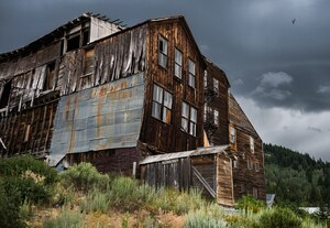 A weathered and beaten hotel lies in the forgotten town of Silver City, Idaho. Once a bustling mining settlement, it's veins have run dry and abandon mine shafts litter the Mountainside. (U.S. Air Force photo by Airman 1st Class Connor J. Marth)