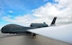 An RQ-4 Global Hawk is prepared for a flight July 28, 2015, on Grand Forks Air Force Base, N.D. Grand Forks AFB was one of several agencies involved in Red Flag 15-3. Red Flag is a three-week training exercise used to prepare Airmen for combat in air, space and cyberspace. (U.S. Air Force photo by Airman 1st Class Ryan Sparks/released)