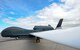 An RQ-4 Global Hawk is prepared for a flight July 28, 2015, on Grand Forks Air Force Base, N.D. Grand Forks AFB was one of several agencies involved in Red Flag 15-3. Red Flag is a three-week training exercise used to prepare Airmen for combat in air, space and cyberspace. (U.S. Air Force photo by Airman 1st Class Ryan Sparks/released)