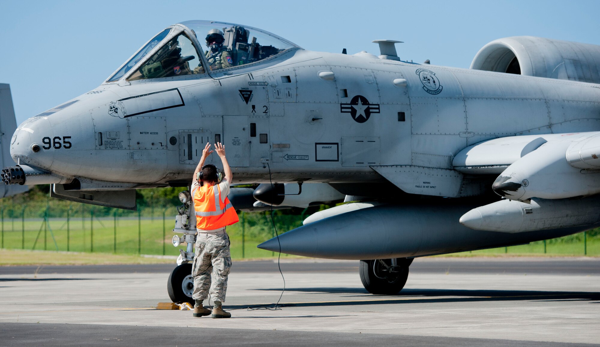 Staff Sgt. Chris Zamora, a 65th Operations Support Squadron transient alert maintenance technician, marshalls in 1st Lt. Josh Woodard, a 354th Expeditionary Fighter Squadron A-10 Thunderbolt II pilot, on Lajes Field, Azores, Portugal, August 1, 2015. The 354th Expeditionary Fighter Squadron returns home after deploying 12 A-10s as part of a Theater Security Package in support of Operation Atlantic Resolve, to Spangdahlem AB, Germany where they conducted training alongside our NATO allies to strengthen interoperability and to demonstrate U.S. commitment to the security and stability of Europe. (U.S. Air Force photo by Master Sgt. Bradley C. Church).