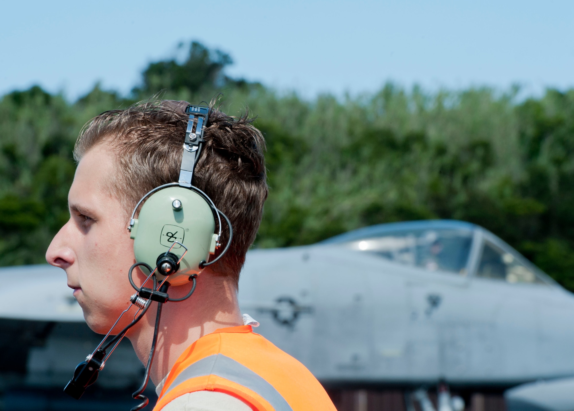 Senior Airman Samuel Clark, a 65th Operations Support Squadron transient alert maintenance technician, prepares to marshall in an A-10 Thunderbolt II on Lajes Field, Azores, Portugal, August 1, 2015. The 354th Expeditionary Fighter Squadron returns home after deploying 12 A-10s as part of a Theater Security Package in support of Operation Atlantic Resolve, to Spangdahlem AB, Germany where they conducted training alongside our NATO allies to strengthen interoperability and to demonstrate U.S. commitment to the security and stability of Europe. (U.S. Air Force photo by Master Sgt. Bradley C. Church).