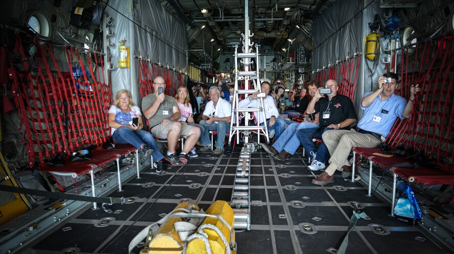 Employers of the 934th Airlift Wing Airmen capture the view above Lake Superior from aboard a C-130 aircraft with the back open during the annual Employer's Day event.  The August training assembly weekend event allows employers to see what their employee(s) do during unit training assembly weekends, learn more about the Reserve mission, and gain a greater understanding of what it means for their employee(s) to be a member of the 934 AW. (U.S. Air Force photo by Staff Sgt. Corban Lundborg/Released)