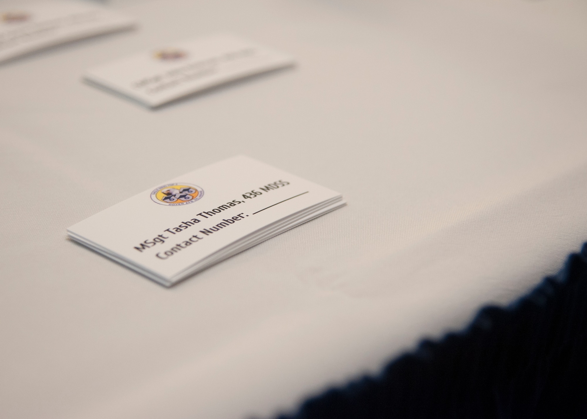 Cards rest on a table before the start of the Top III’s Speed Mentoring, July 29, 2015, at The Landings Club on Dover Air Force Base, Del. The cards were created by the Top III for Senior NCOs to use during the event, allowing the Airmen and NCOs to contact them at a later date. (U.S. Air Force photo/Senior Airman Jared Duhon) 
