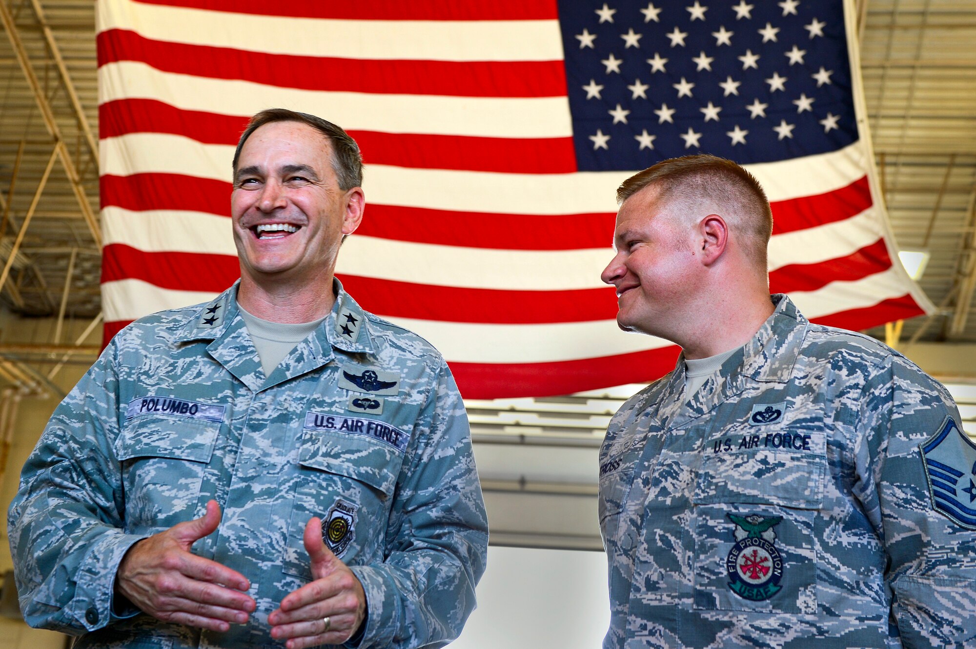 U.S. Air Force Maj. Gen. H. D. Polumbo Jr., Ninth Air Force commander, speaks to the 20th Civil Engineer Squadron fire department after coining Master Sgt. Mark Tross, 20th Civil Engineer Squadron assistant fire chief, at Shaw Air Force Base, S.C., July 28, 2015. Polumbo thanked Tross for his hard work within the department and recognized him with a Ninth Air Force commander’s coin. (U.S. Air Force photo by Senior Airman Jensen Stidham/Released)