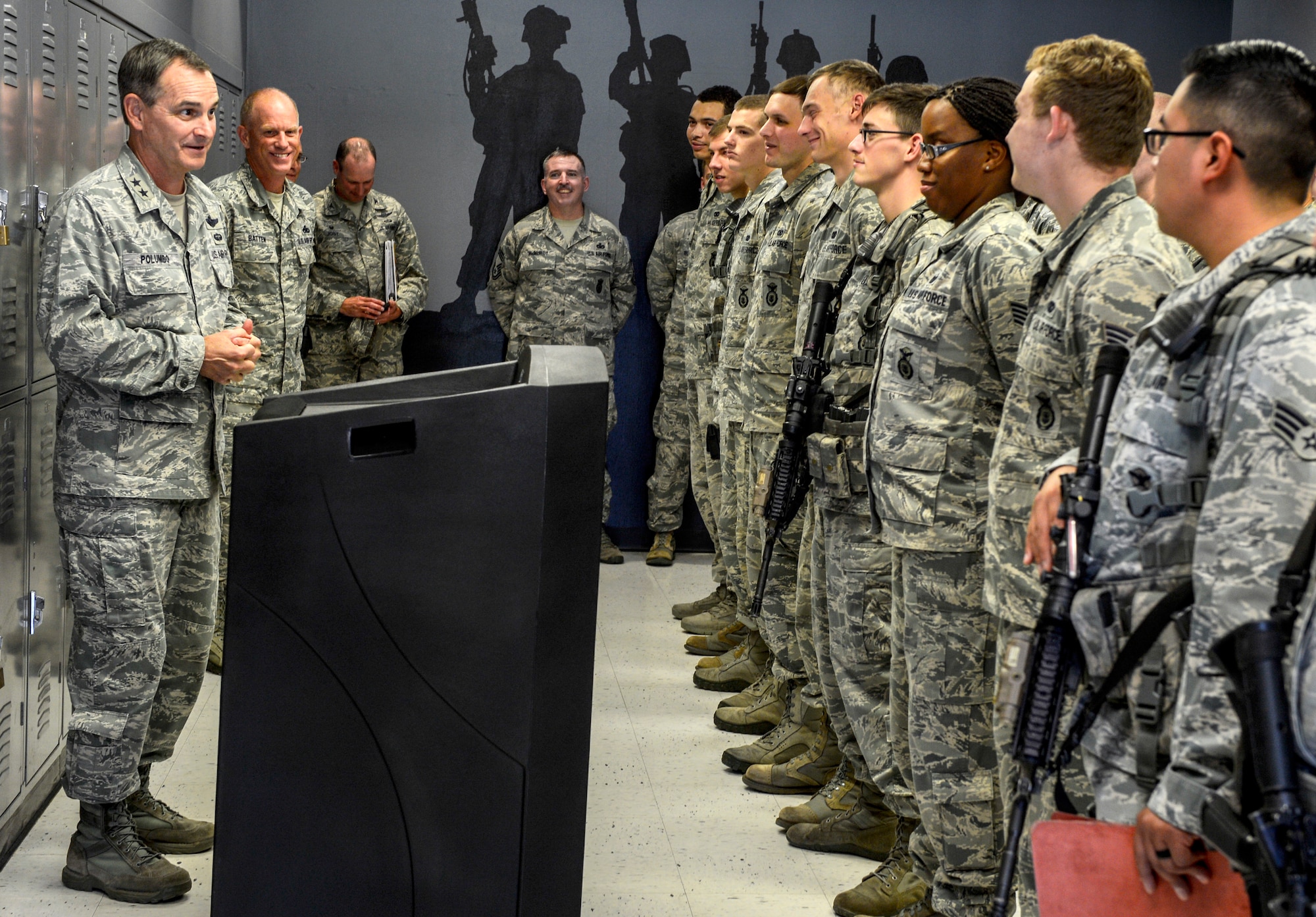 U.S. Air Force Maj. Gen. H. D. Polumbo Jr., Ninth Air Force commander, speaks to a 20th Security Forces Squadron flight during a guard mount changeover at Shaw Air Force Base, S.C., July 28, 2015. Polumbo thanked the Airmen and coined those who had demonstrated exceptional military professionalism and leadership. (U.S. Air Force photo by Senior Airman Jensen Stidham/Released)