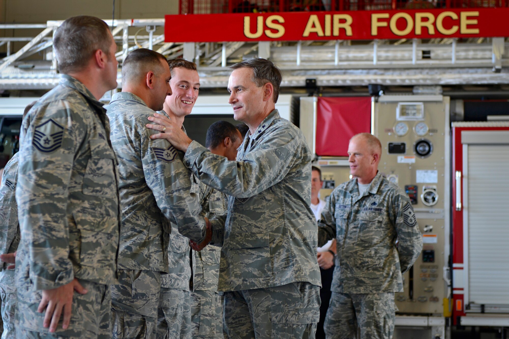 U.S. Air Force Maj. Gen. H. D. Polumbo Jr., Ninth Air Force commander, greets members of the 20th Civil Engineer Squadron fire department at Shaw Air Force Base, S.C., July 28, 2015. Polumbo visited the department to coin Airmen as well as thank the firefighters for their service. (U.S. Air Force photo by Senior Airman Jensen Stidham/Released) 