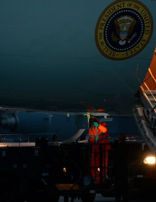 Airman 1st Class Nicholas Almanza, 721st Aerial Port Squadron fleet service specialist, connects a line from a lavatory service truck to Air Force One July 28, 2015, at Ramstein Air Base, Germany. This was Almanza’s second opportunity to serve Air Force One in his career. President Obama was traveling to Africa and stopped at Ramstein to refuel. (U.S. Air Force photo/Airman 1st Class Tryphena Mayhugh)