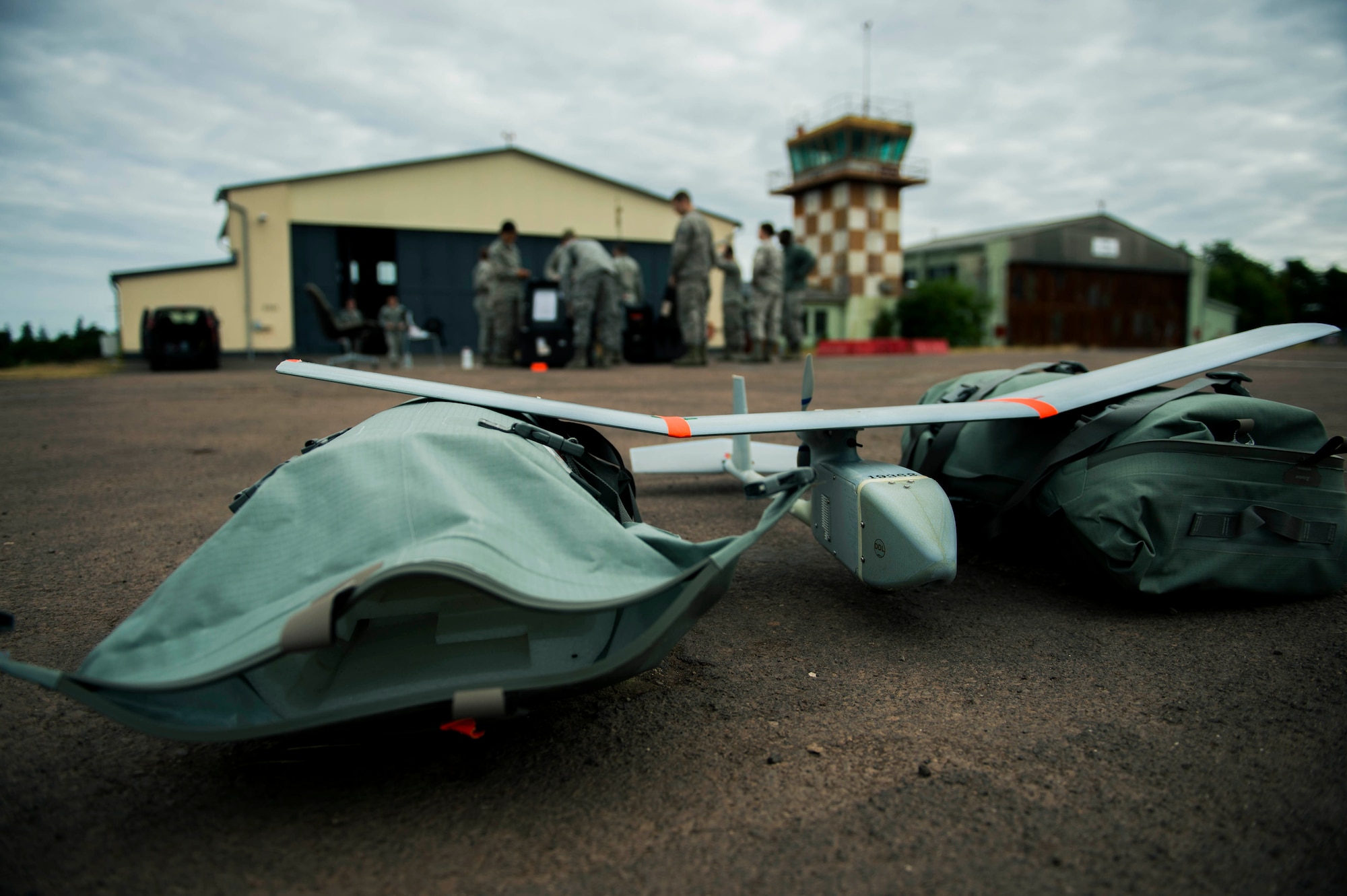 A Raven B small unmanned aerial system with a digital data link rests between cushioning during SUAS proficiency and currency training at the airfield on U.S. Army Garrison Baumholder, Germany, July 23, 2015. SUAS operators attend a two-week initial qualification training course before gaining authorization to pilot the SUAS. (U.S. Air Force photo by Airman 1st Class Timothy Kim/Released) 
