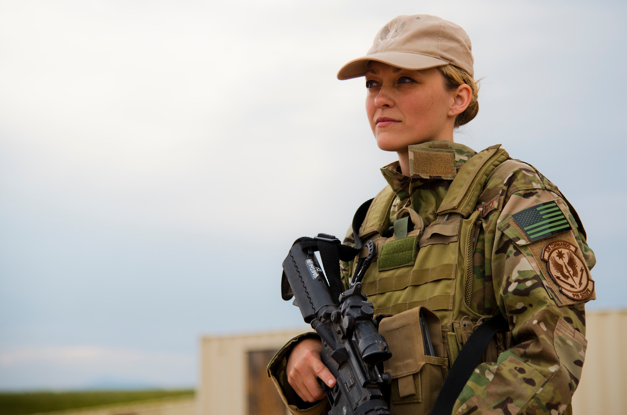 Senior Airman Amanda Smith, 919th Special Operations Security Forces Squadron, looks out over the vast landscape during the squadron’s annual training at Camp Guernsey, Wyo., Aug. 3.  More than 20 Airmen went out West to help train two other Reserve security forces squadrons in ground combat and field training.  The 919th SOSFS Airmen lived in the makeshift camps and acted as opposing forces and local villagers interacting with the occupying security teams. (U.S. Air Force photo/Tech. Sgt. Sam King)