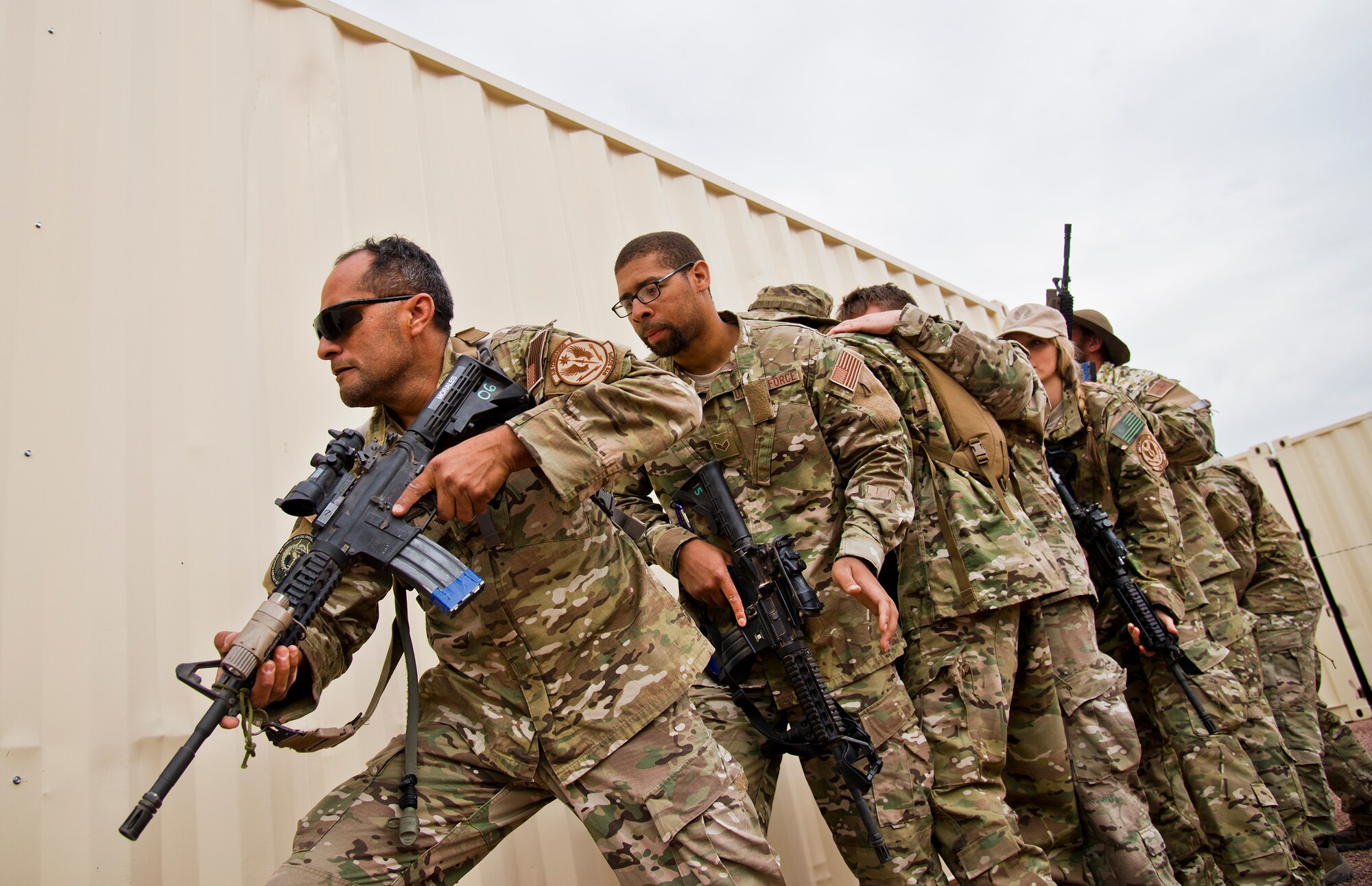 Master Sgt. Paul Morales, 919th Special Operations Security Forces Squadron, leads his team in building clearing scenario during the squadron’s annual training at Camp Guernsey, Wyo., Aug. 3.  More than 20 Airmen went out West to help train two other Reserve security forces squadrons in ground combat and field training.  The 919th SOSFS Airmen lived in the makeshift camps and acted as opposing forces and local villagers interacting with the occupying security teams. (U.S. Air Force photo/Tech. Sgt. Sam King)