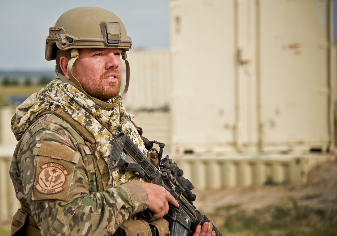 Senior Airman Aaron Bradley, 919th Special Operations Security Forces Squadron, looks out over the vast landscape during the squadron’s annual training at Camp Guernsey, Wyo., Aug. 3.  More than 20 Airmen went out West to help train two other Reserve security forces squadrons in ground combat and field training.  The 919th SOSFS Airmen lived in the makeshift camps and acted as opposing forces and local villagers interacting with the occupying security teams. (U.S. Air Force photo/Tech. Sgt. Sam King)