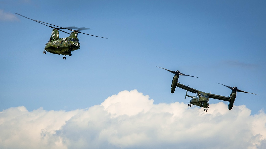 The Ch-46 and V-22 Osprey begins there landing during the CH-46 Retirement Ceremony at the Smithsonian Institution National Air and Space Museum’s Steven Udvar-Hazy Center in Chantilly, Virginia Aug. 1, 2015. The ceremony was conducted by Marines from Medium Helicopter Squadron 774 4th Marine Aircraft Wing, Marine Corps Forces Reserve, and Marines from Marine Helicopter Squadron One from Marine Corps base Quantico, Virginia.