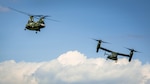 The Ch-46 and V-22 Osprey begins there landing during the CH-46 Retirement Ceremony at the Smithsonian Institution National Air and Space Museum’s Steven Udvar-Hazy Center in Chantilly, Virginia Aug. 1, 2015. The ceremony was conducted by Marines from Medium Helicopter Squadron 774 4th Marine Aircraft Wing, Marine Corps Forces Reserve, and Marines from Marine Helicopter Squadron One from Marine Corps base Quantico, Virginia.