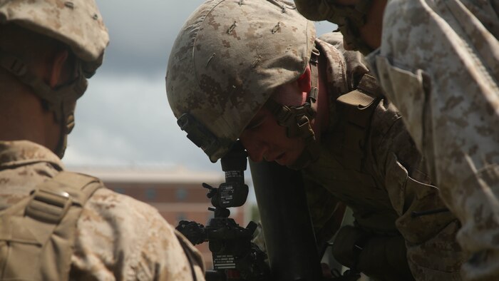 A Marine with 1st Battalion, 8th Marine Regiment, 2nd Marine Division, checks the line of sight on an 81mm Mortar during a training exercise aboard Camp Lejeune, N.C. July 30, 2015. Marines with the unit conducted “hip shoots” to better prepare them on the go. A “hip shoot” is where mortar teams receive a call for fire on the move and use their leadership and teamwork to set-up the mortars and begin supporting the unit. 