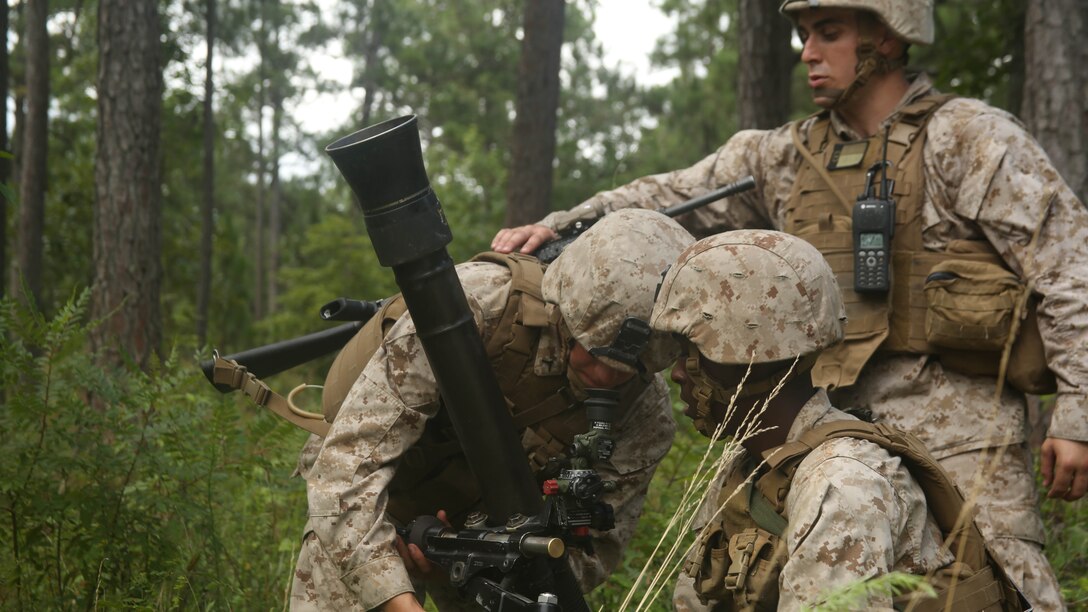 Marines with 1st Battalion, 8th Marine Regiment, 2nd Marine Division, set up an 81mm mortar as they conduct a “hip shoot” aboard Camp Lejeune, N.C. July 30, 2015. Marines in the unit took part in a training event in which they were taught the practical application of the “hip shoot” as well as refining their basic skill sets. 