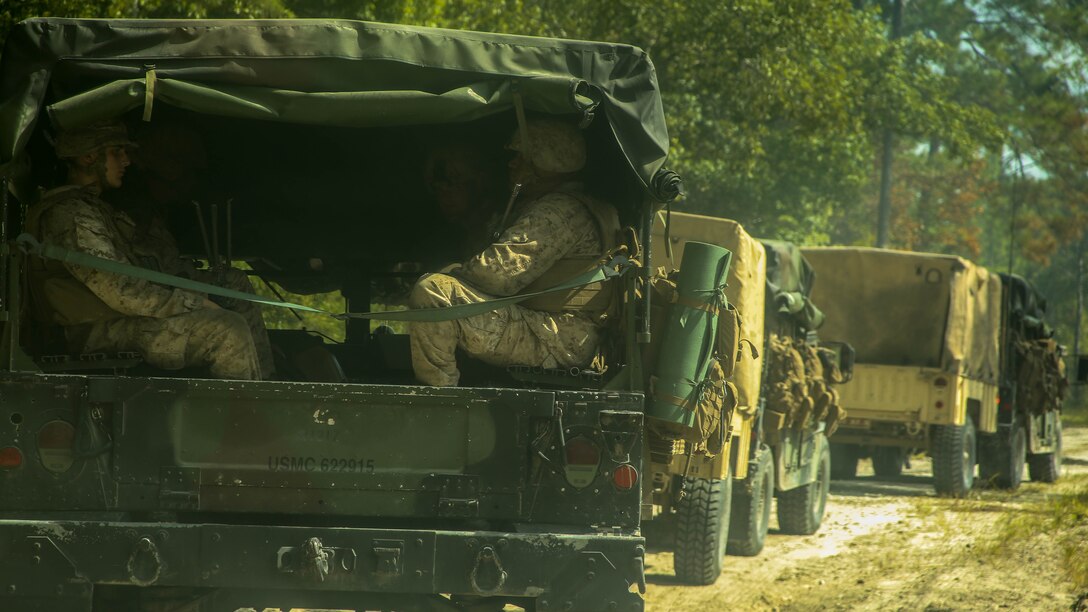 Marines with 1st Battalion, 8th Marine Regiment, 2nd Marine Division, prepare to begin a training exercise aboard Camp Lejeune, N.C. July 30, 2015. Marines participating in the exercise conducted “hip shoots” in order to better support the battalion while on the move. 