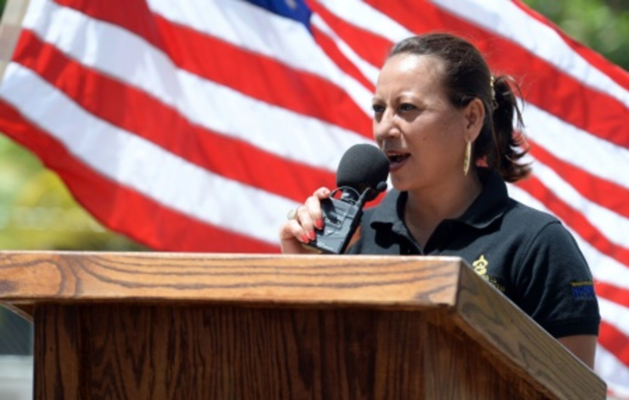 Director Doris Maradiaga, Colón Department of Education district director, speaks at the ribbon-cutting ceremony for the new two-classroom schoolhouse at the Gabriela Mistral school in Ocotes Alto, Honduras, July 28, 2015. The event marked the official opening of the building which was one of the key projects as part of the New Horizons Honduras 2015 training exercise taking place in and around Trujillo, Honduras. New Horizons was launched in the 1980s and is an annual joint humanitarian assistance exercise that U.S. Southern Command conducts with a partner nation in Central America, South America or the Caribbean. The exercise improves joint training readiness of U.S. and partner nation civil engineers, medical professionals and support personnel through humanitarian assistance activities. (U.S. Air Force photo by Capt. David J. Murphy/Released)
