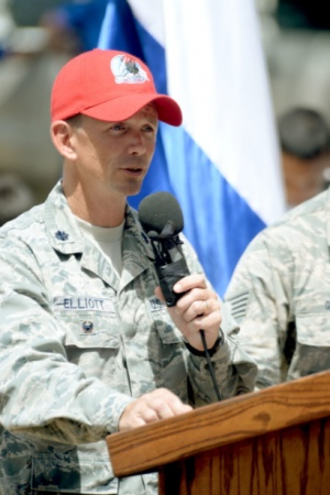 U.S. Air Force Lt. Col. Ryan Elliott, 823rd RED HORSE Squadron deputy commander and New Horizons Honduras exercise commander, out of Hurlburt Field, Fla., speaks at the ribbon-cutting ceremony for the new two-classroom schoolhouse at the Gabriela Mistral school in Ocotes Alto, Honduras, July 28, 2015. The event marked the official opening of the building which was one of the key projects as part of the New Horizons Honduras 2015 training exercise taking place in and around Trujillo, Honduras. New Horizons was launched in the 1980s and is an annual joint humanitarian assistance exercise that U.S. Southern Command conducts with a partner nation in Central America, South America or the Caribbean. The exercise improves joint training readiness of U.S. and partner nation civil engineers, medical professionals and support personnel through humanitarian assistance activities. (U.S. Air Force photo by Capt. David J. Murphy/Released)