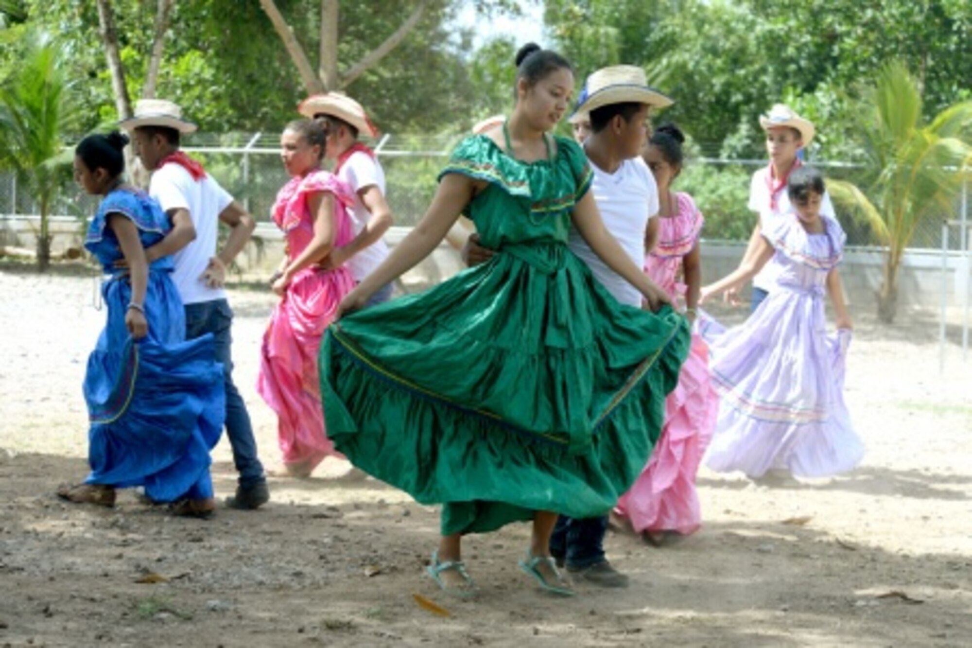 Gabriela Mistral students perform a traditional dance during the ribbon-cutting ceremony at the Gabriela Mistral school in Ocotes Alto, Honduras, July 28, 2015. The ribbon-cutting ceremony celebrated the opening of the new two-classroom schoolhouse. The schoolhouse was one of the key projects that occurred as part of the New Horizons Honduras 2015 training exercise taking place in and around Trujillo, Honduras. New Horizons was launched in the 1980s and is an annual joint humanitarian assistance exercise that U.S. Southern Command conducts with a partner nation in Central America, South America or the Caribbean. The exercise improves joint training readiness of U.S. and partner nation civil engineers, medical professionals and support personnel through humanitarian assistance activities. (U.S. Air Force photo by Capt. David J. Murphy/Released)
