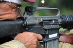 Sweat Pours down the face of All Guard team member, Arizona Army National Guard Sgt. 1st Class Robert Pirisky as he fires during a 600-yard prone match at the 50th annual Interservice Rifle Championship at Marine Corps Base Quantico, Va. July 19 to 26, 2011.