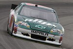 Dale Earnhardt Jr., driver of the No. 88 National Guard NASCAR racecar, speeds down the track at the Pocono Raceway in Long Pond, Pa., Aug. 7, 2011. Earnhardt finished ninth and was able to maintain his tenth place position in the points race after Sunday’s race.